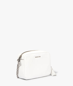 Jet set camera bag in optic white by Michael Kors. EQVVS Side Angle Shot.