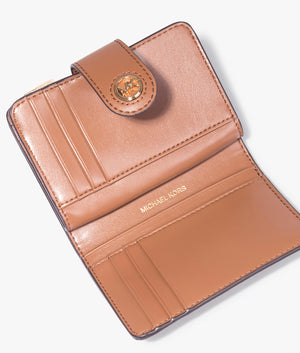 MK charm wallet in luggage