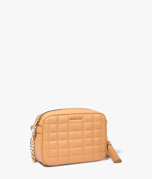 Jet set quilted crossbody bag in pale peanut by Michael Kors. EQVVS WOMEN Side Angle Shot.