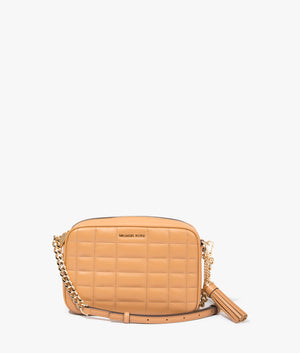 Jet set quilted crossbody bag in pale peanut by Michael Kors. EQVVS WOMEN Front Angle Shot.