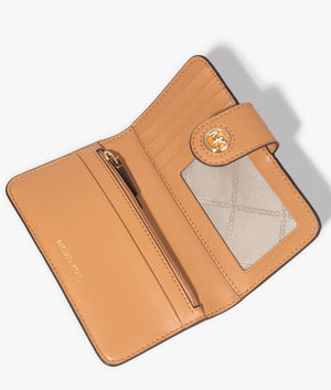 MK charm bifold wallet in pale peanut by Michael Kors. EQVVS WOMEN Open Shot.