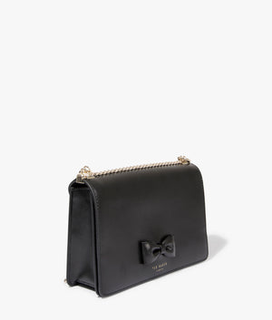 Baeleen bow detail leather crossbody in black by Ted Baker. EQVVS WOMEN Side Angle Sot.
