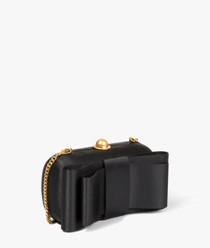 Bowela satin bow clutch in black by Ted Baker. EQVVS WOMEN Side Angle Shot.