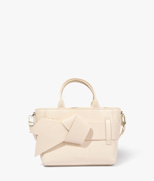 Jimsie mini knot bow bag in ivory by Ted Baker. EQVVS WOMEN Front Angle Shot.