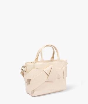 Jimsie mini knot bow bag in ivory by Ted Baker. EQVVS WOMEN Side Angle Shot.