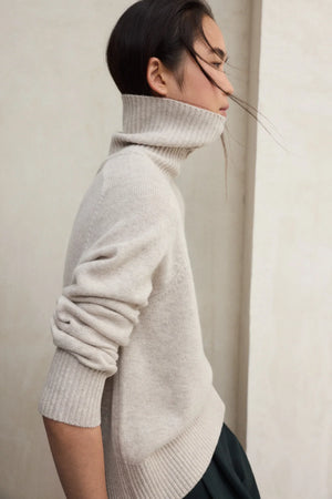 Caqui roll neck knit in oat melange