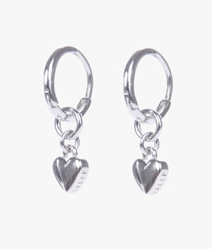 Harrie tiny heart huggie earrings in silver.
