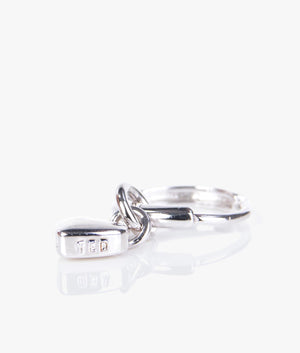 Harrye tiny heart huggie earrings in silver.