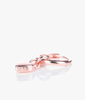 Harrye tiny heart huggie earrings in rose gold.