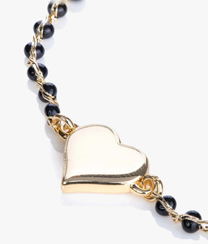 Rainba heart bracelet in gold and black.