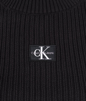 Badge cropped high neck top in black