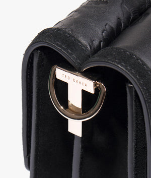 Floresa laser cut shoulder bag in black
